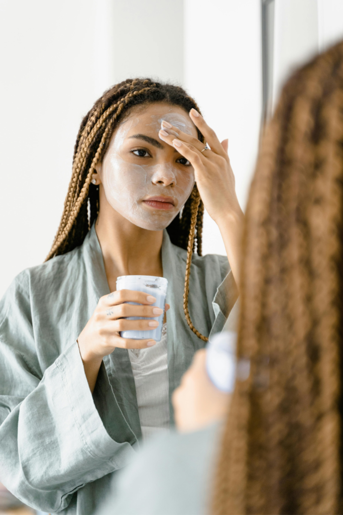 applying sunscreen in morning skincare routine
